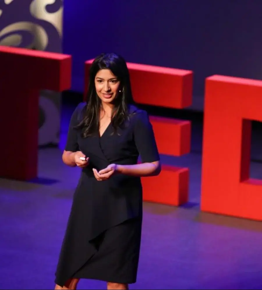 Maddy Kulkarni speaking on the TEDx stage
