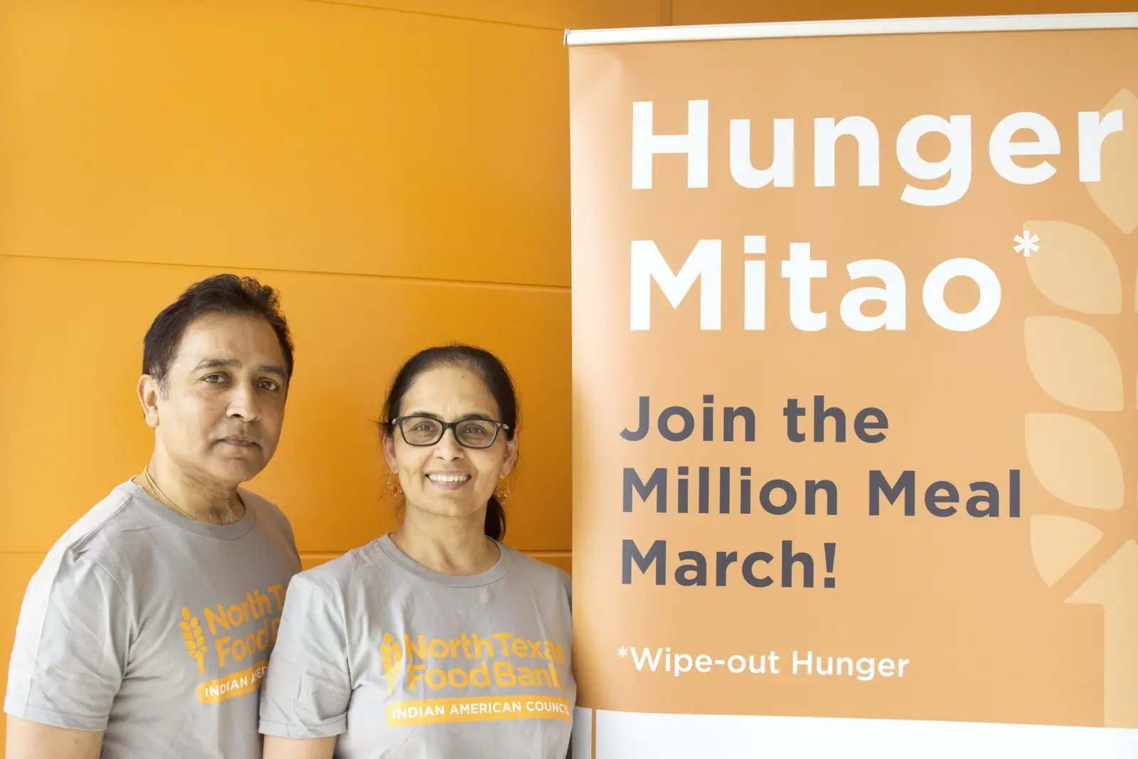Dallas Heroes Project honorees Raj and Anna at a North Texas Food Bank Hunger Mitao event